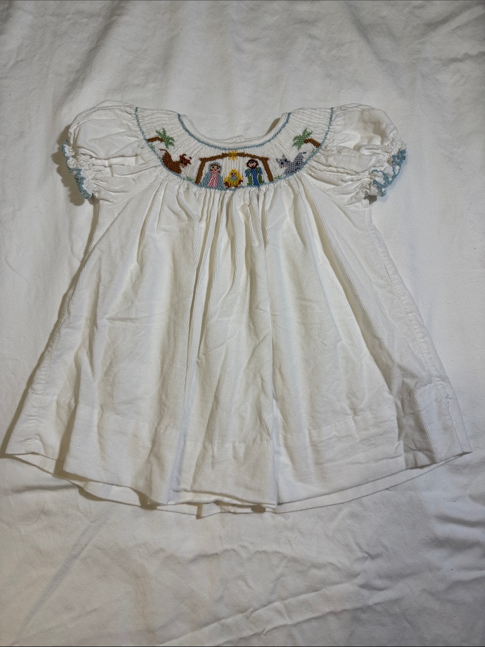 Petit Bebe White Corduroy Smocked Dress w/ Nativity Embroidery - 9 months